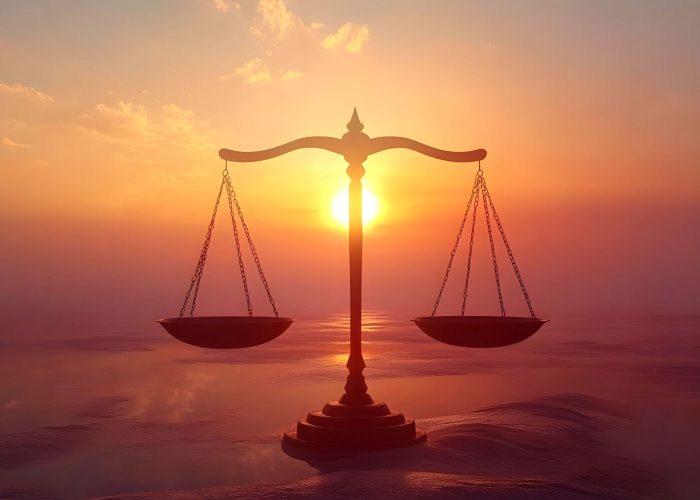 Scales of justice at sunset Scales of justice at sunset